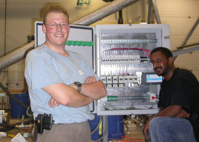 Yotam and me standing in front of the attached contactor cabinet