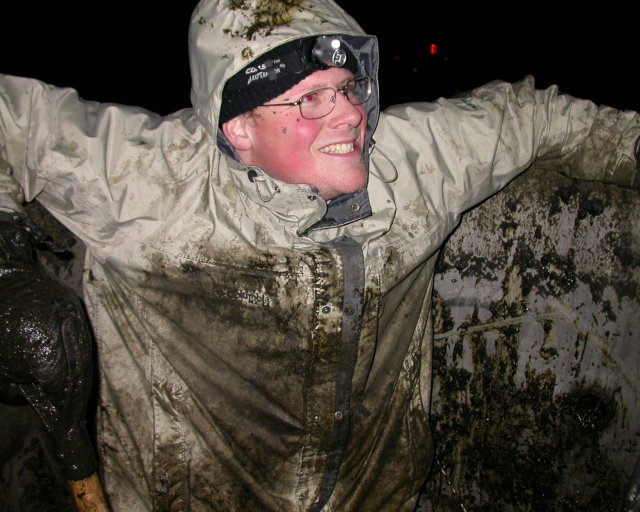 Me, covered in manure, climbing out of the tank